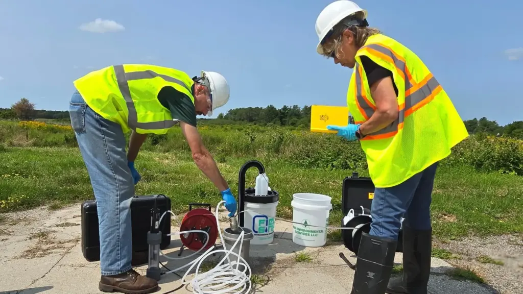 Environmental technician collecting soil and groundwater samples during a drilling investigation.